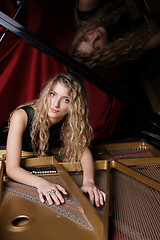 Image showing woman playing piano