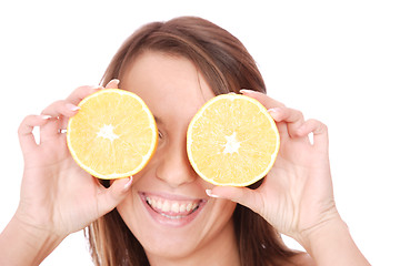 Image showing happy model eating an orange