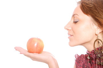 Image showing A pretty young woman holding an apple 