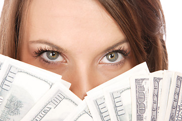 Image showing Attractive woman takes lot of 100 dollar bills