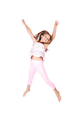 Image showing Little girl jumps 