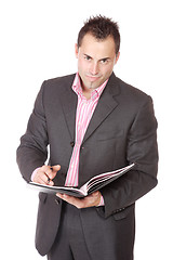 Image showing Confident businessman with notebook