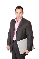 Image showing Happy businessman holding laptop computer