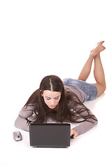 Image showing casual woman with a laptop, working on the floor.