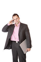 Image showing Happy businessman holding laptop computer