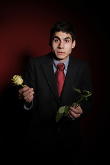 Image showing  Young happy smiling handsome man with rose