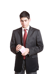 Image showing Portrait of a business man holding money 