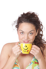 Image showing Young woman with a cup