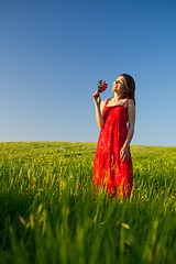 Image showing Happy woman with flowers