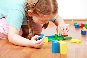 Image showing Adorable girl playing with blocks