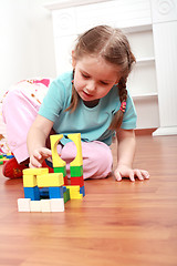 Image showing Adorable girl playing with blocks