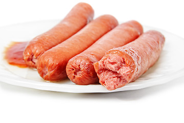 Image showing Sausages with ketchup