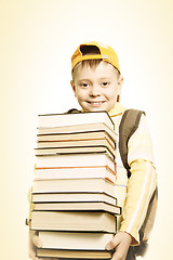 Image showing Smiling schoolboy with books