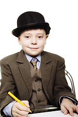 Image showing Boy in bowler with yellow pen