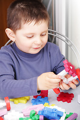 Image showing Boy playing with toy blocks