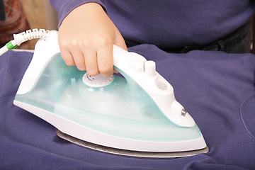 Image showing Ironing hand