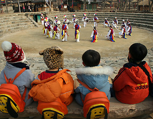 Image showing School childen watching traditional dancers