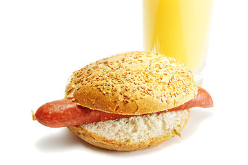 Image showing Hotdog and orange juice
