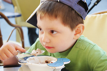 Image showing Boy eats ice-cream