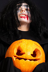 Image showing Vampire with pumpkin