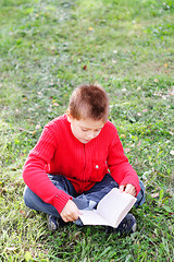 Image showing Sitting and reading