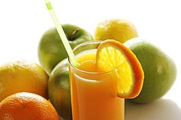 Image showing Orange juice in glass in front of fruits