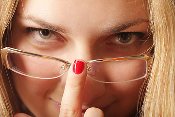 Image showing Adjusting eyeglasses