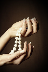 Image showing Pearl in hands