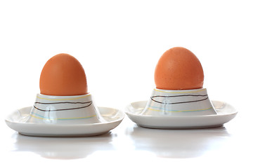 Image showing Two eggs in eggcups reflecting