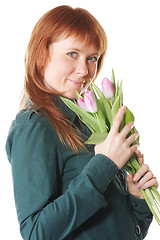 Image showing Redhead in green with pink tulips