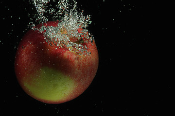 Image showing Red apple in water