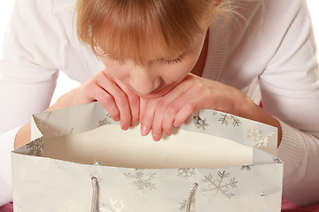 Image showing Woman looking into empty bag