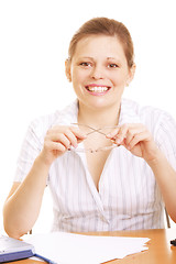 Image showing Smiling woman holding spectacles