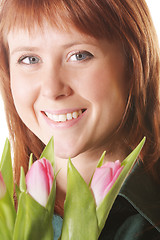Image showing Positive redhead with pink tulips
