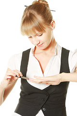 Image showing Woman making manicure herself