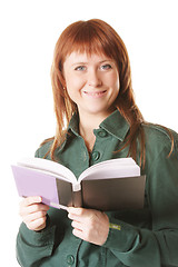 Image showing Smiling redhead with open book