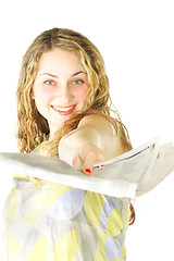 Image showing Woman passing newspaper