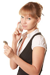 Image showing Serious woman with phone and watch