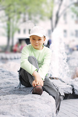 Image showing Boy outdoors in sunny day