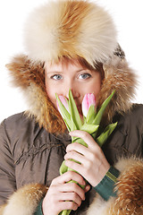 Image showing Redhead in warm clothes with tulips