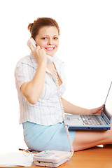 Image showing Woman sitting on table