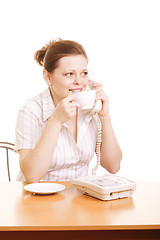 Image showing Woman with cup talking on phone