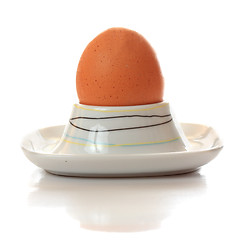 Image showing Egg in eggcup reflecting