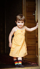Image showing Little girl at house door