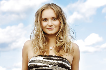 Image showing Fair-haired girl over cloudscape