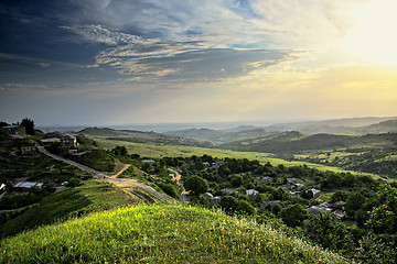 Image showing Sun over mountain countryside