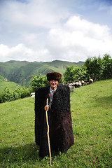 Image showing Herdsman in mountains