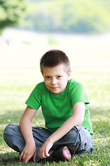 Image showing Serene boy in casual on grass