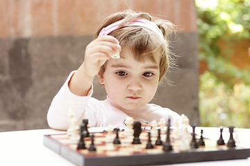 Image showing Girl playing chess