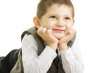 Image showing Smiling kid looking up